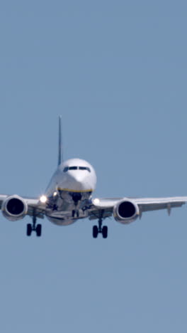 airplane-landing-at-barcelona-airport-in-vertical