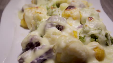 colorful broccoli cauliflowers plate and bechamel