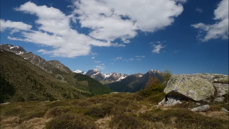 timelaps shot of fast moving clouds in the mountains in spring, dolomites, italy