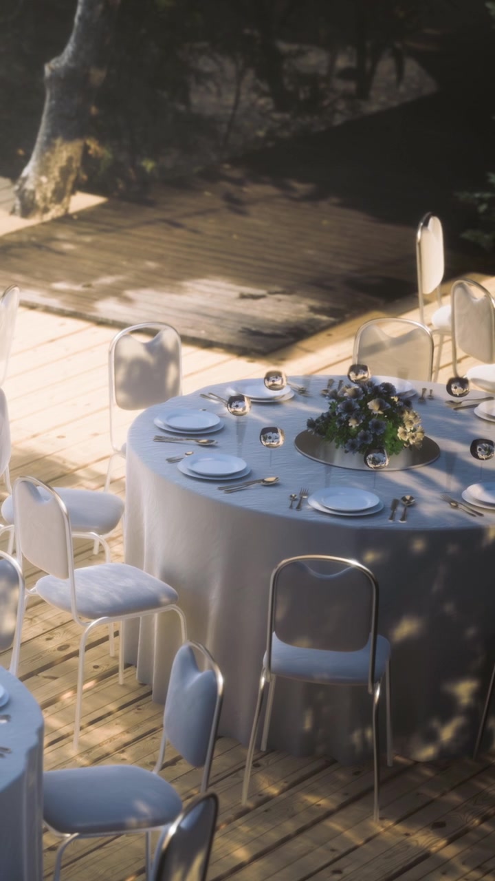 Outside table setting with empty chairs during afternoon light