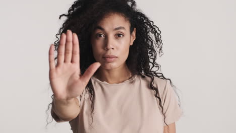 african american confident woman over white background.