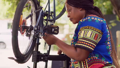 Woman-grabs-screwdriver-to-fix-bicycle