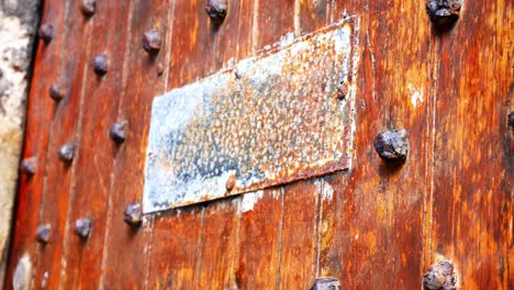 heavy wood plank old medieval door with metal stud pattern stud nail doorway dolly left