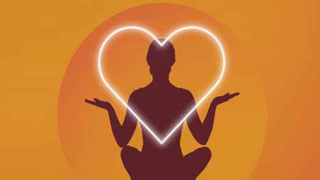 Animation-of-silhouette-of-woman-meditating-over-heart