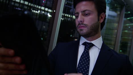 arabic businessman working tablet technology night hotel lobby
