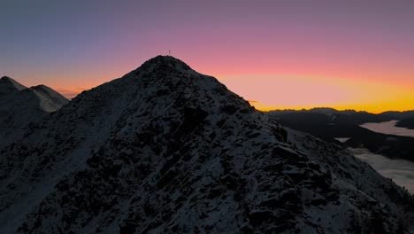 pre-dawn glow over snowy italian peaks, captured by drone