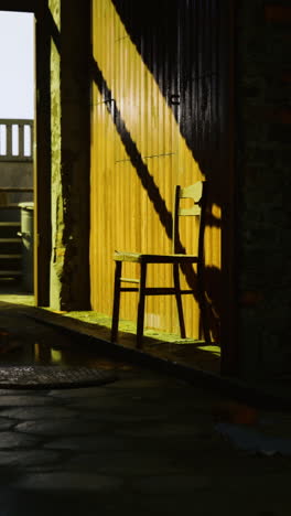 empty urban space features hanging sock and scattered furniture in shadow