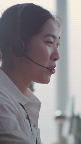 woman talking on headset in office setting