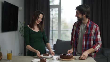 Handsome-husband-treating-his-beloved-wife-with-tasty-desert