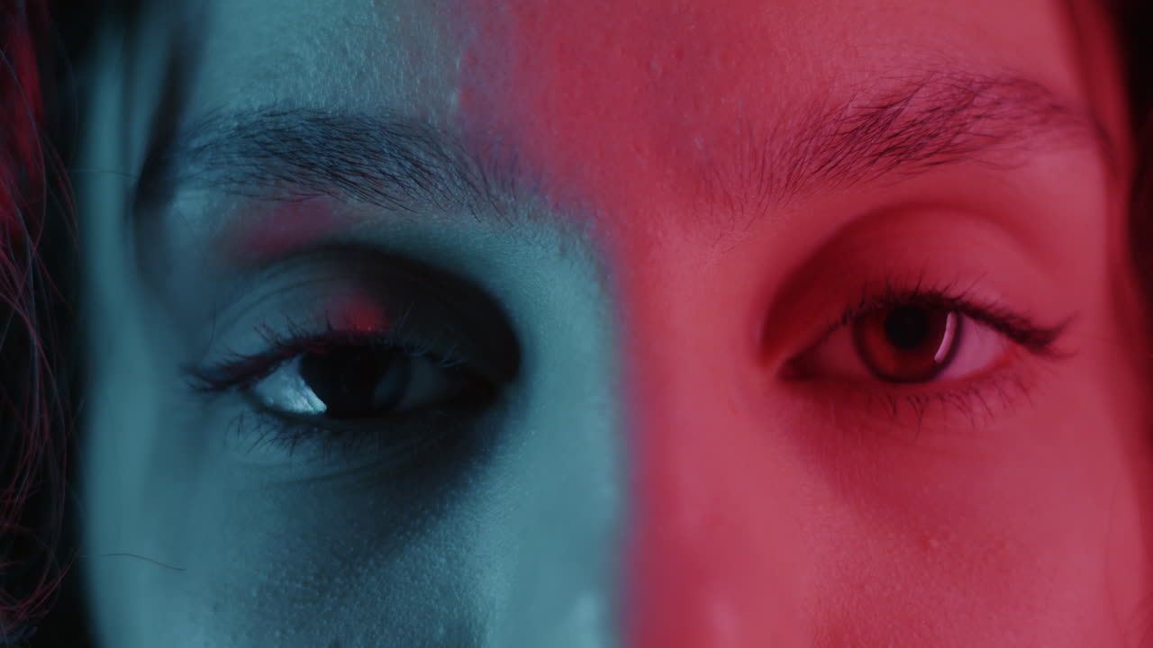 Close-up of woman's face with neon lighting