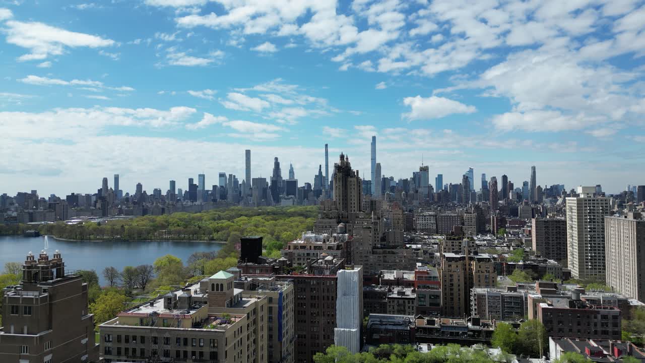Aerial drone push-in shot of West 96 Street, New York, in horizontal orientation, capturing city streets, residential buildings, and urban scenery.