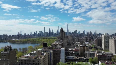 aerial drone push-in shot of west 96 street, new york, in horizontal orientation, capturing city streets, residential buildings, and urban scenery.