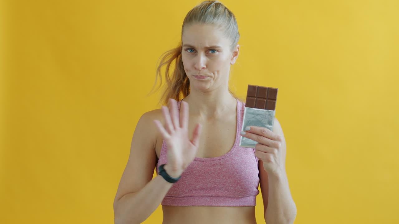Woman considering eating chocolate