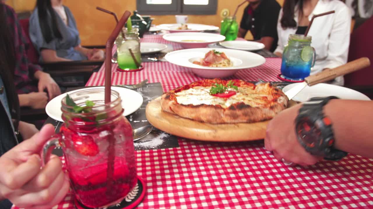 The Waiter Puts Pizza On The Table In The Restaurant , Full Hd
