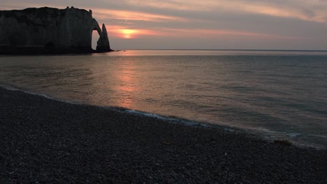 Silhouette-of-Etretat-world-famous-naturally-formed-archways-cliffs-during-sunset