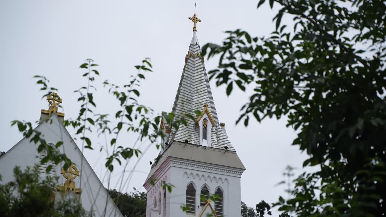 There is a church on the top of the mountain. It is located in Darjeeling