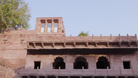 ancient-red-stone-unique-stepwell-architecture-at-day-from-different-angle-angle-video-is-taken-at-Toorji-ka-Jhalra-or-stepwell-jodhpur-rajasthan-india