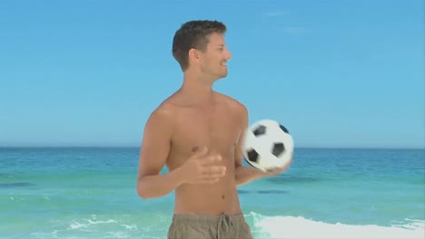 handsome man playing with a soccer ball