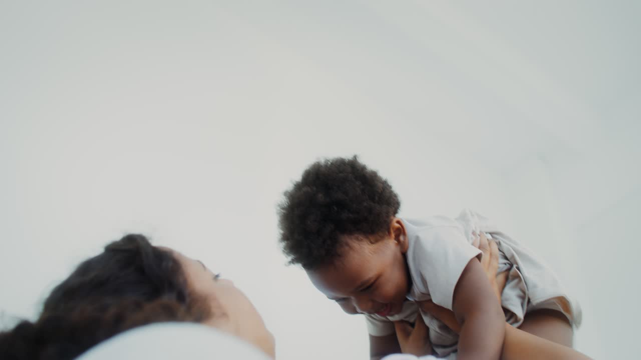 Mother playing with baby