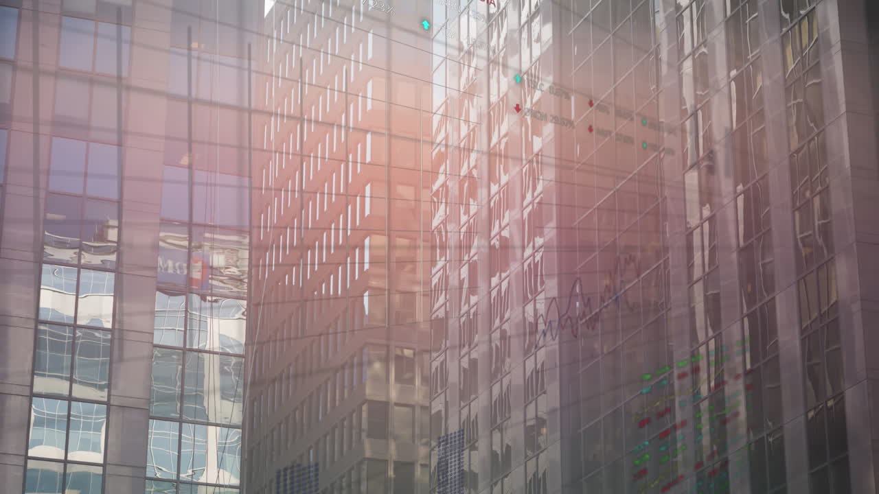 여러 그래프의 애니메이션과 현대 유리 건물의 배경에 무역 보드