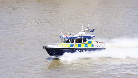 police boat speeding on the thames river