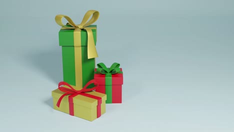 Video-of-three-christmas-presents-spinning-with-copy-space-over-grey-background