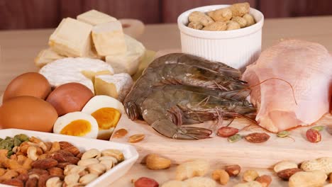 variety of protein-rich foods displayed on wood