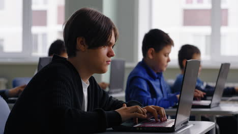 Students using laptops in a classroom