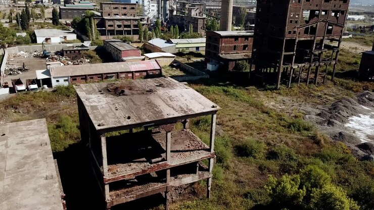 Drone view of the abandoned metal factories at Kombinati Metalurgjik, Albania, Balkans, Europe Crane shot