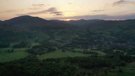 static aerial footage from loughrigg fell at sunrise looking towards ambleside