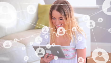 Animation-of-network-of-connections-with-people-icons-over-caucasian-woman-using-tablet