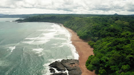 4k aerial drone shot of tambor empty beach in costa rica