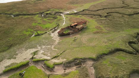 spiral rise view of shipwrecks on salt marsh at fleetwood marshes nature reserve
