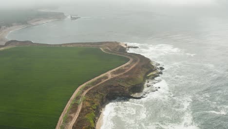 Aerial-view-of-Farm-off-the-coast-off-of-High-way-1-in-Northern-California