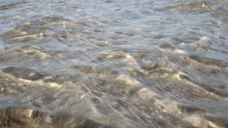 Ripples-of-water-on-the-sand-on-a-beach