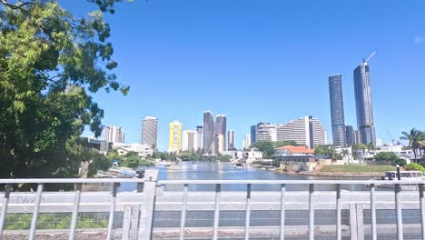 city skyline and nature along a coastal road