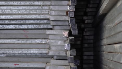 metal recyclables are neatly arranged. appearance is old. tilt shot from top to bottom.