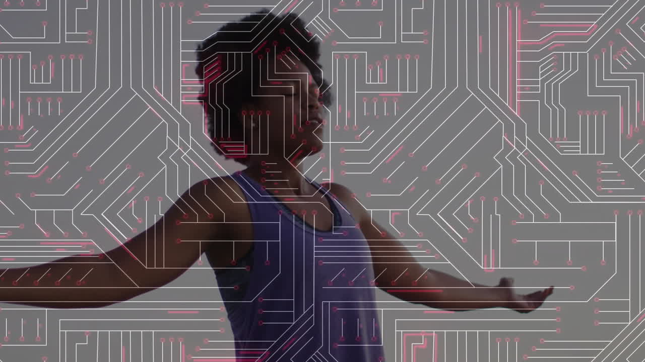 Person with arms outstretched overlaid with circuit board pattern animation