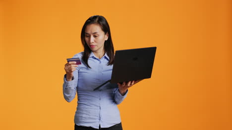 trendy woman ordering products online on laptop