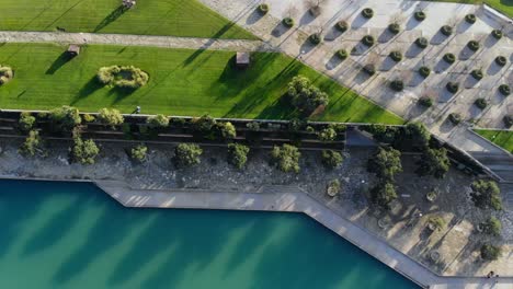 drone in palma facing down at park and the pond by the cathedral