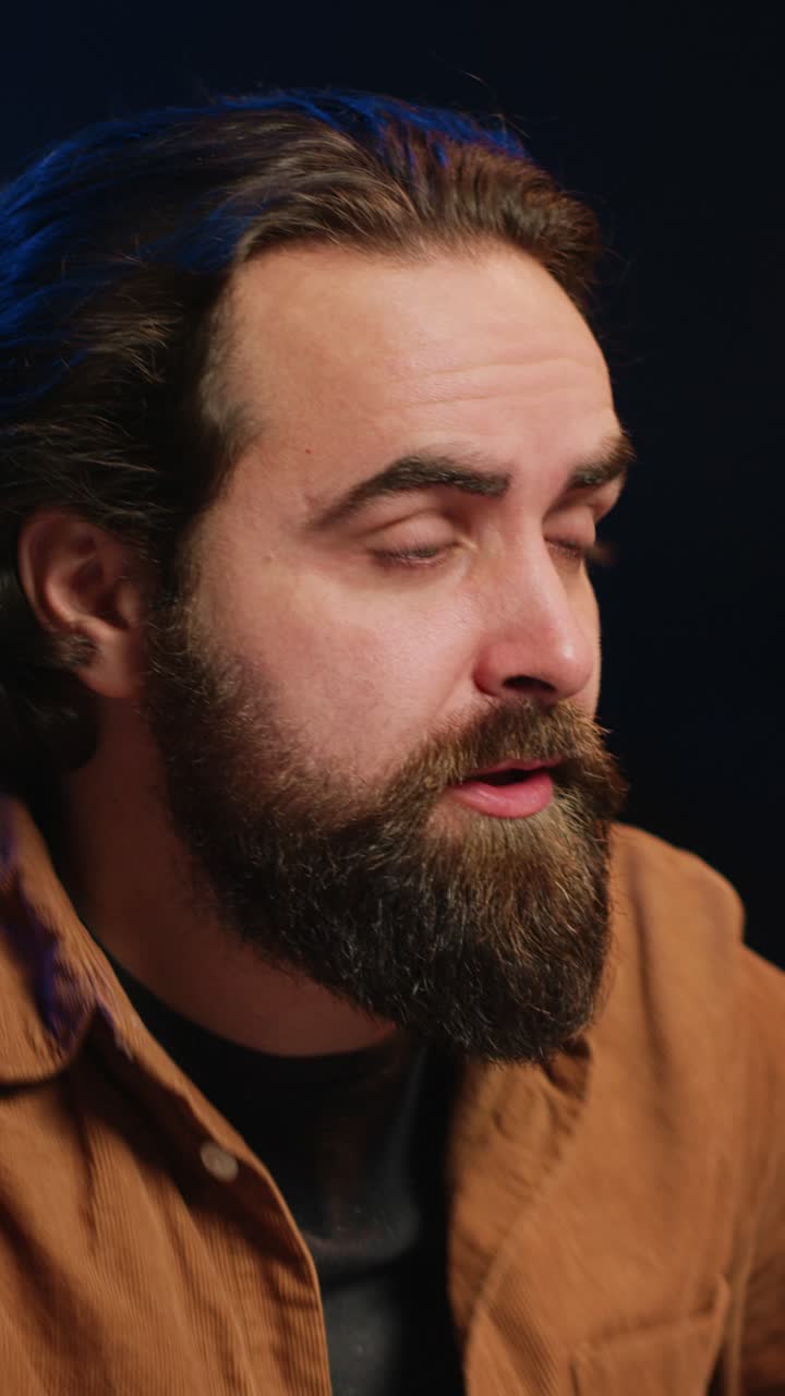 Bearded Man Showing Signs of Stress and Frustration