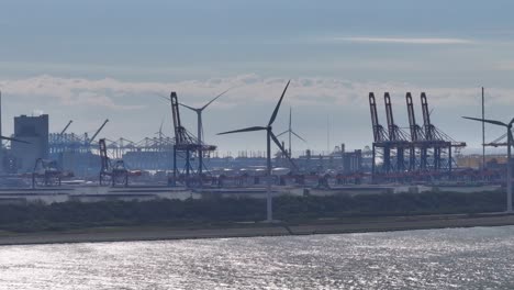 the euromax terminal situated against the backdrop of a blue sky within the port of rotterdam in the netherlands - pan up shot