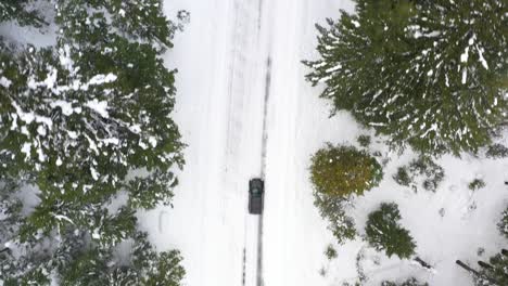 aerial view of snow covered road in the winter