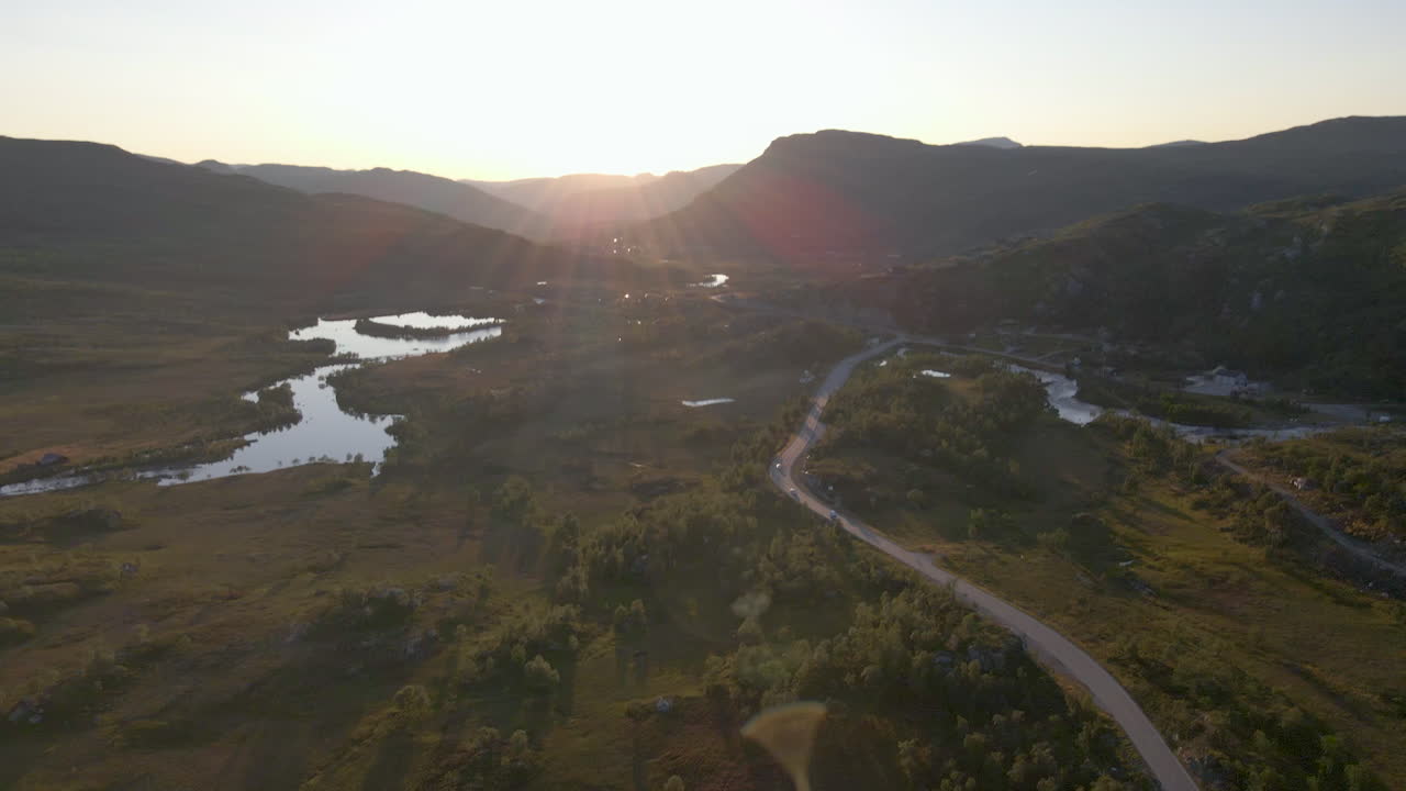 Aerial shot of Hardanger in Norway at sunset with forest and mountains