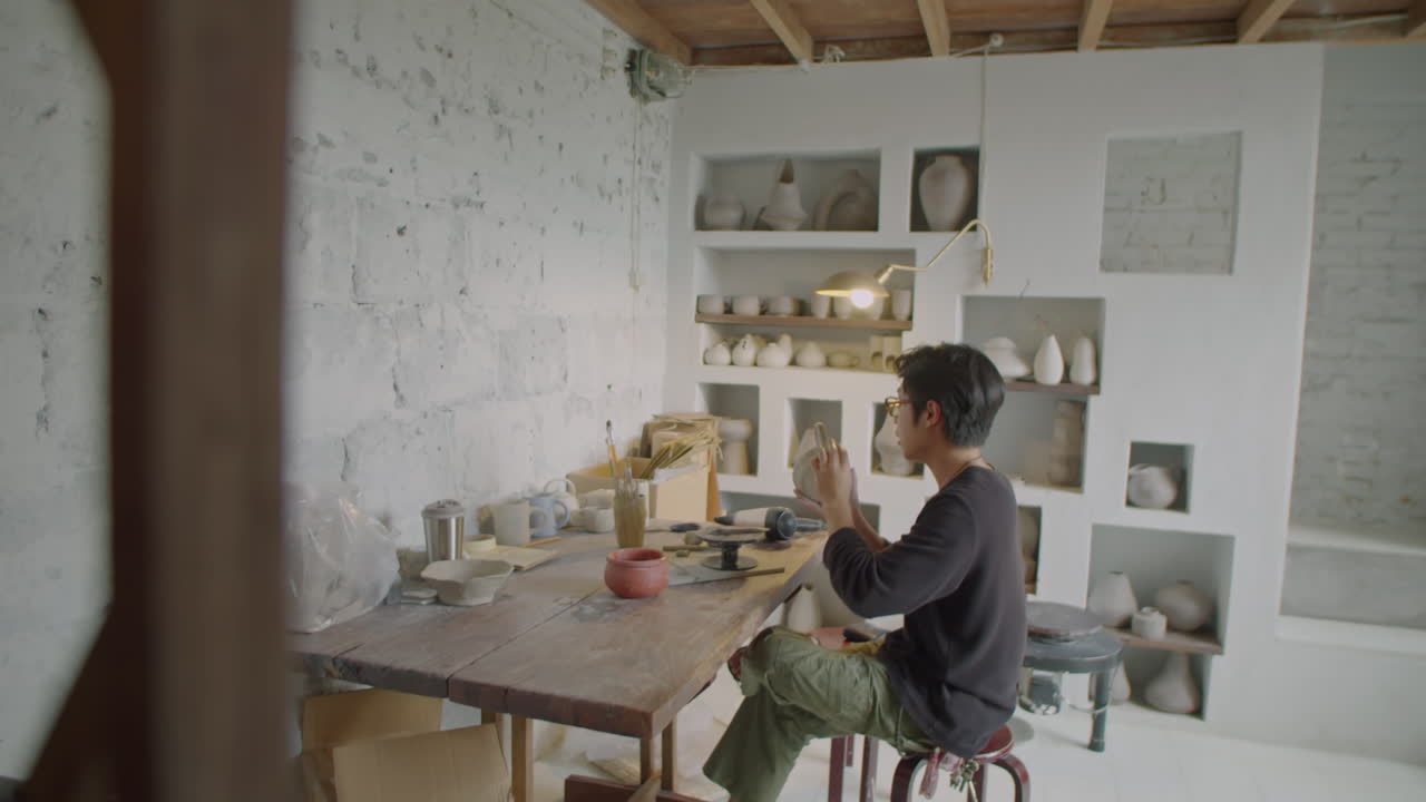 Artisan Making Ceramics in Pottery Studio