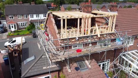 aerial shot rotates around a semi-detached house having a dormer loft conversion