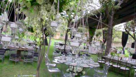 candels arragament holding by a flowers arragement of white roses in a wedding decoration