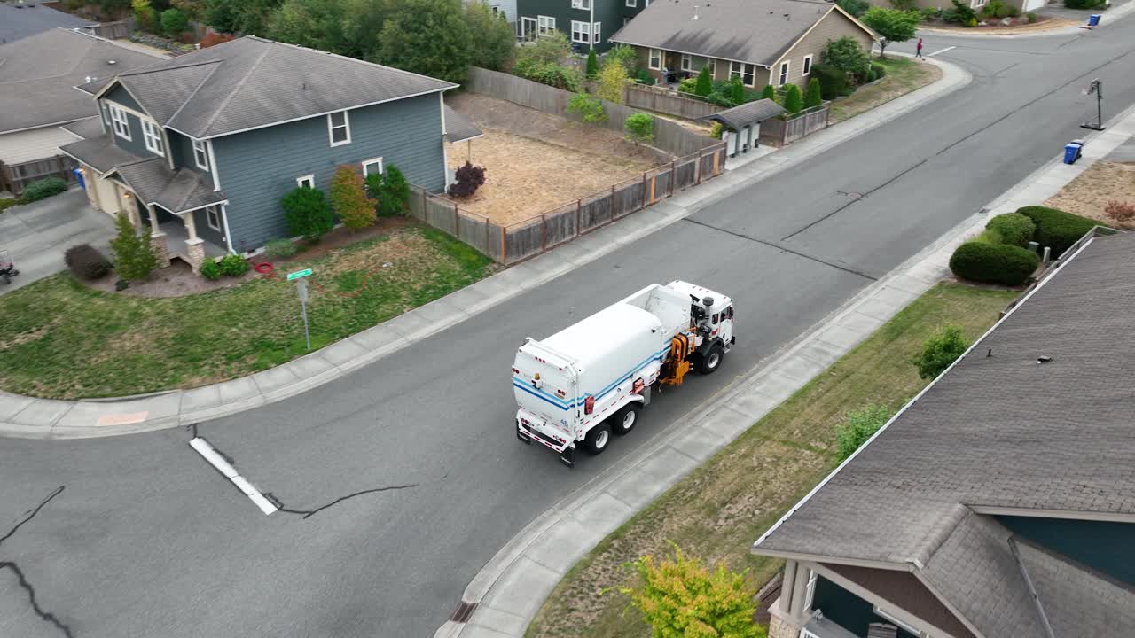 Drone shot following a dump truck as it