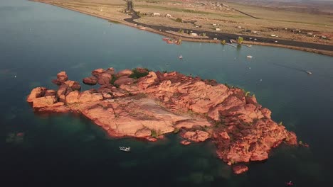 red rock sandstone island in sand hollow state park lake and water reservoir, drone aerial view, utah usa