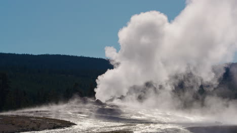 geyser eruption with massive steam plume